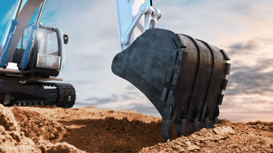 Construction machinery at work digging a hole